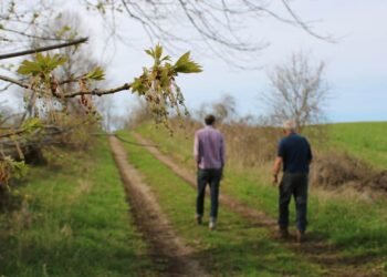 Two men walking on the Kidd CEA