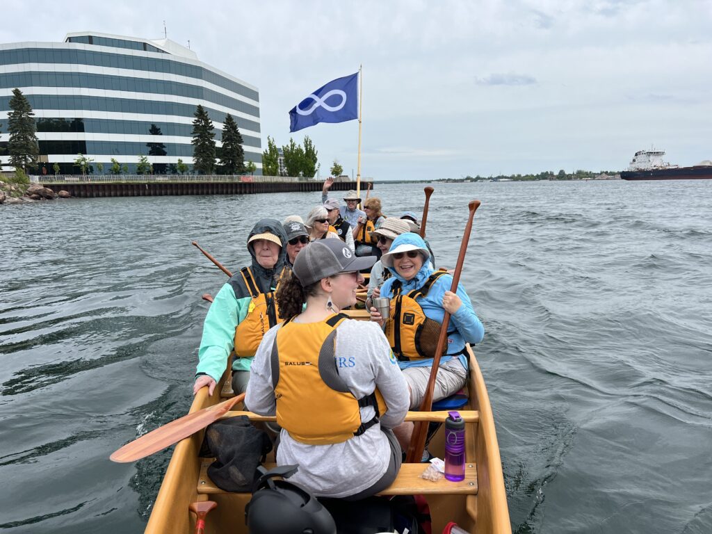 Métis Tours guide Lauren Towell on a walking and paddling tour on Saint Marys River in Sault Ste Marie